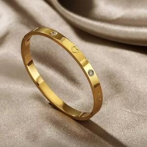 GOLD STAINLESS STEEL LOVE BRACELET